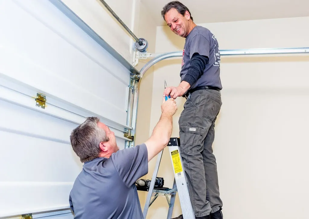 The Quick Response Garage Door Services crew workng on a garage door repair project in Phoenix, Arzona