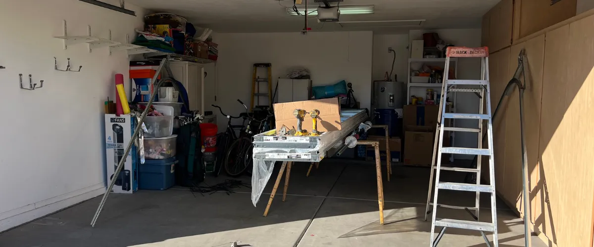 Technician unloading parts from service truck for garage door installation