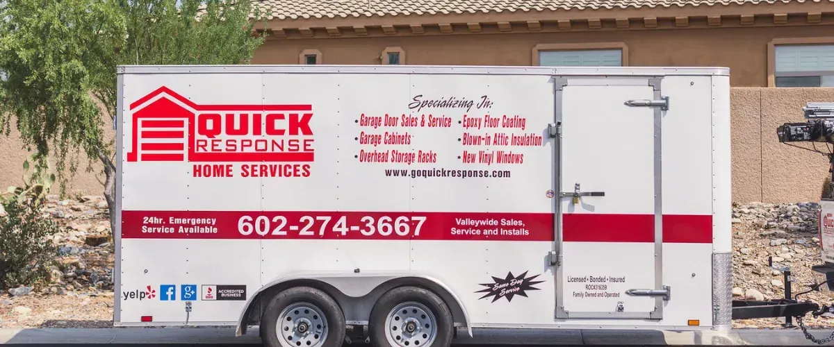 Quick Response Home Services trailer showing garage door, epoxy floor, and cabinet services.